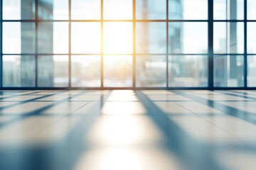 Poster - Sunlight streaming through large windows in an empty office creates soft shadows on the floor, fostering a tranquil atmosphere filled with potential and fresh beginnings