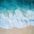 © Ahmad - Soft blue ocean wave on clean sandy beach background