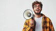 © Barosanu - A joyful man smiles widely while holding a megaphone, dressed casually, effectively portraying a sense of positivity and approachability in a minimalistic setting.