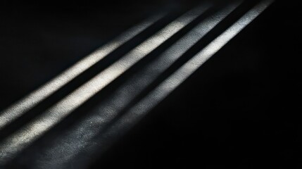 Poster - radiant sun rays breaking through darkness isolated on a deep black background creating a striking c