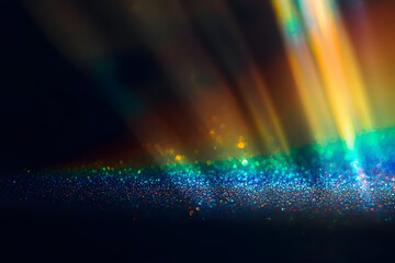 Poster - Rainbow sun flares on black background, colorful glare and shine, light rays on sparkling surface. Rainbow refraction of bright sunlight on dark fon. Natural light effects, trend aesthetic