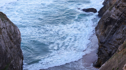 Wall Mural - waves crashing on rocks