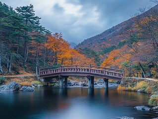 Poster - Wooden bridge over calm river in autumnal forest landscape.