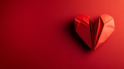 Poster - Folded red paper heart resting on textured background, expressing romantic emotion