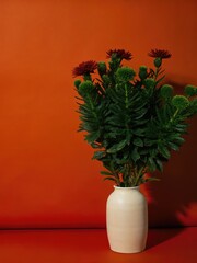 Poster - Elegant Vase With Colorful Flowers Against a Vibrant Background. Generative AI