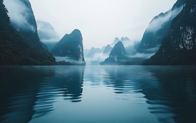 Poster - Misty mountains reflected in calm lake water.