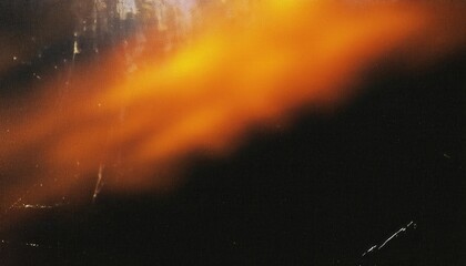 Poster - Blurred Orange Glow in Darkness. Abstract Artistic Light Streaks Against Black Background Evoking Fire, Energy, and Motion