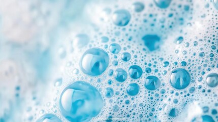 Poster - Delicate blue bubbles and foam cluster together, reflecting light and creating an interesting texture in a macro shot