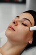 © callisto - Woman undergoing facial treatment at a spa during a serene afternoon session