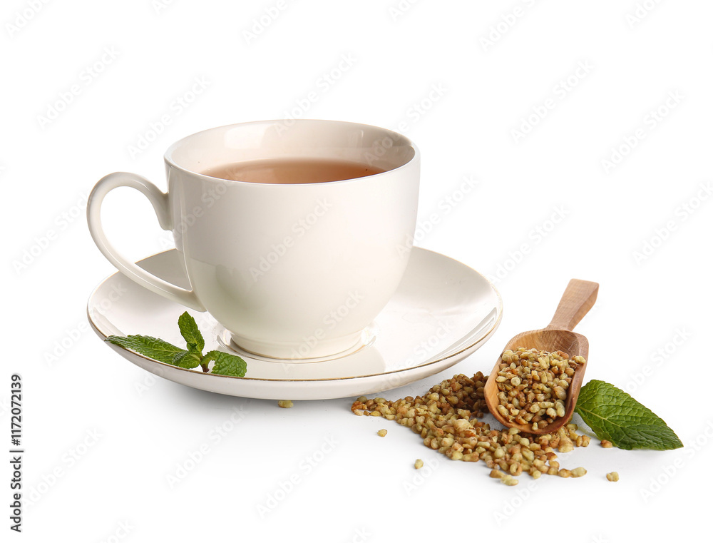 Cup of hot buckwheat tea with mint on white background