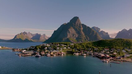 Wall Mural - explore a picturesque coastal village in norway nestled between majestic mountains and tranquil wate