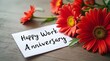 © Stock Photo Zone - Happy Work Anniversary Greeting Card with Vibrant Red Gerbera Daisies on Rustic Wooden Table
