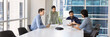© fizkes - Wide shot of young diverse business colleagues working on project together in meeting room, talking at large table, discussing business strategy, plan, teamwork, partnership. Banner picture