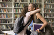 © fizkes - I am happy for you. Excited candid girl teenager wearing school backpack hug embrace smiling overjoyed female student classmate greet friend with high mark on exam congratulate with success in study