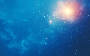 bright light shining through blue nebula.