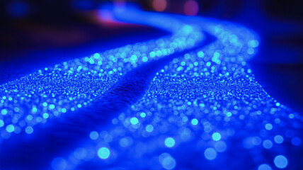 Poster - Blue Abstract Stream of Light: A mesmerizing abstract photograph of a swirling, luminescent blue stream of light. The image evokes a sense of movement, energy, and possibility.