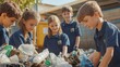 © Kenny - Caucasian children sorting recyclable plastics in outdoor school environment