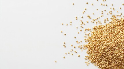 Poster - Fried quinoa scattered on a white background for culinary and health-related concepts in food photography.