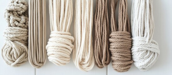 Aufkleber - Neutral macrame cords in earthy tones arranged on a white background ideal for crafting projects and stylish DIY home decor ideas