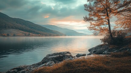 Aufkleber - Serene lakeside view at dawn with tranquil waters mountains and autumn foliage in a picturesque natural landscape