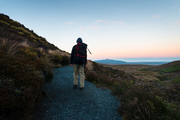 Hiking Tongariro Alpine Crossing at sunrise. Mangatepopo Valley. Tongariro National park.