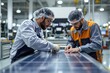 © ThomasLENNE - Two colleagues in factory working on solar cell