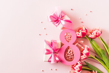 Wall Mural - Number eight with bouquet of tulips on a pink background. International Women's Day concept