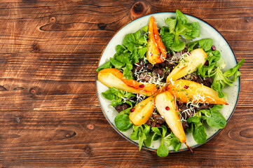 Wall Mural - Salad with liver, caramelized pear in a plate.