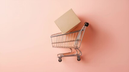 Aufkleber - Small metal shopping cart carrying cardboard box on pastel pink background representing online shopping, e commerce, online payment and delivery service