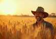 © puruan - Smiling farmer in golden wheat field at sunset enjoying a successful harvest