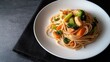© Mia  - Enjoying a hearty bowl of vegetable pasta with a savory sauce at home during a cozy evening
