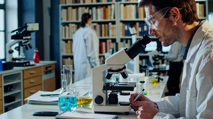 Poster - Scientist conducts research in laboratory using microscope and analyzing samples