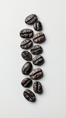 Poster - Dark roasted coffee beans are levitating and arranged in a vertical line on a minimalist white background, creating a visually appealing and aromatic scene
