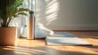 © Eliza - mata do jogi, buty sportowe, butelka ze stali nierdzewnej, styl minimalistyczny, sportowe akcesoria, podłoga drewniana, światło naturalne, sport, zdrowy styl życia, siłownia, trening, joggers, akcesor
