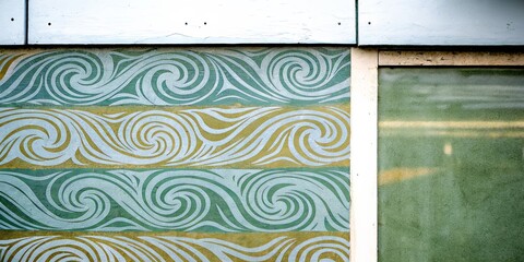 Aufkleber - A wall with a pattern of waves and a window with a green frame
