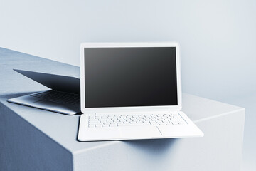 Poster - Minimalist white and silver laptops on clean abstract platforms, showcasing sleek modern design with empty screens for creative projects. 3D Rendering
