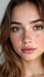 © Andrey - Portrait of a freckled woman with natural facial beauty.