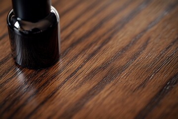 Poster - Close-up of a dark bottle on a rich wood surface.
