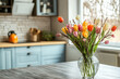 © 7707601 - A bouquet of tulips in a vase on the kitchen table. Easter or Women's day.