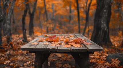 Poster - Vibrant fall leaves scattered across a wooden table, set in an orange-toned forest, creating a tranquil autumn scene full of warmth and natural beauty