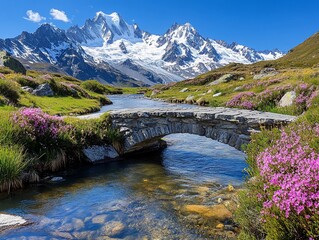 Poster - Stone bridge over a stream in a mountain valley with wildflowers and snow-capped peaks.