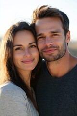 Poster - A man and woman are smiling at the camera. The man is wearing a black shirt and the woman is wearing a gray shirt