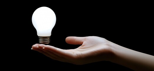 Poster - illuminating light bulb floating above hand symbolizing ideas and creativity, copy space for text