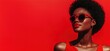 © Vergiliy - Bold Red Fashion Statement with Confident Woman in Sunglasses and Vibrant Lipstick Against Red Background, copy space for text