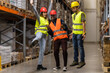 © Nikola Spasenoski - Group of warehouse workers celebrating teamwork and success with cheerful expressions