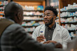 © PhotoProAD - A man in a white lab coat is talking to another man in a suit