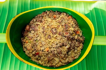 Wall Mural - Traditional Brazilian farofa prepared with toasted cassava flour, bacon, onion and typical spices. Brazilian food