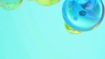 Wall Mural - blue background with three yellow and green spheres floating in the air. the spheres are of differen