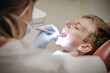 © Nomad_Soul - Dentist examining a patient in a bright, clean dental clinic. Generative AI