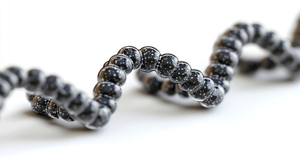 Poster - A dark spiraling structure resembling a chain of interconnected spheres.  Could represent a stylized molecule, nanotechnology, or abstract design.  Suitable for scientific visualizations or futuristic